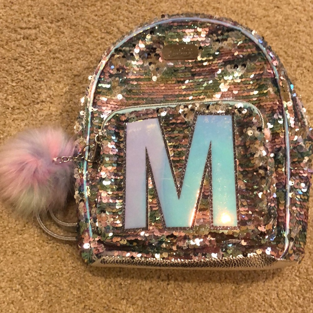 Justice for Girl’s Silver Glitter M Initial Mini Backpack. Initial - M